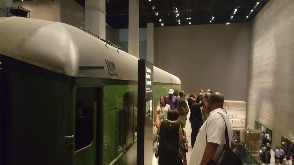 A segregated rail car bridges the gap between the "Era of Segregation" level and the late '60s.