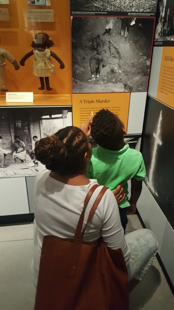 A mom teaching her young son about Chaney, Goodman, and Schwerner -- Mississippi civil rights workers who were murdered.